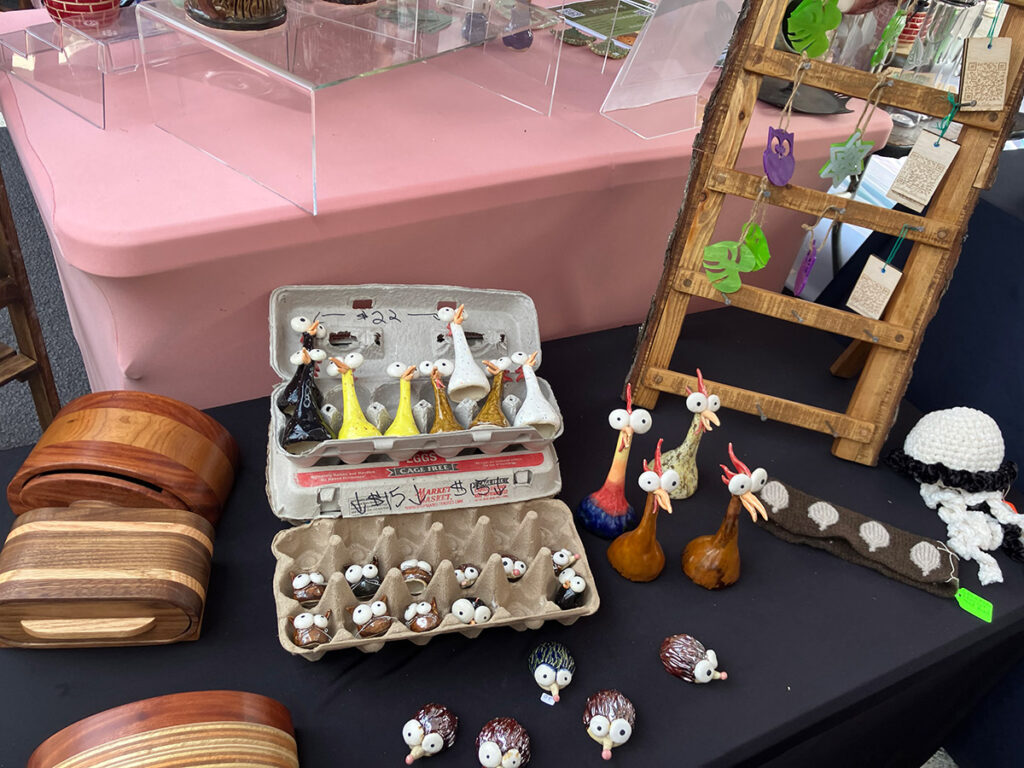 Ceramic animals by Carol Founier and bandsaw carved wooden boxes by Jon Goplerud